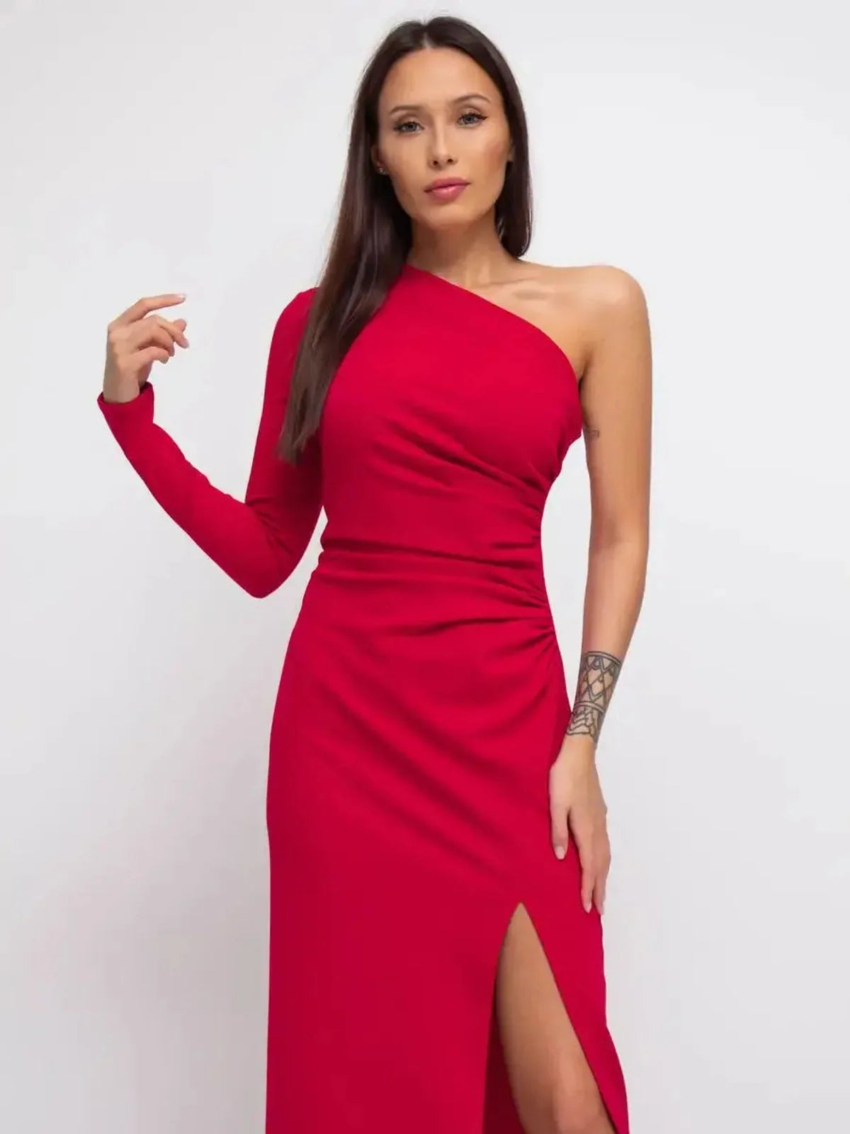 Elegant one-shoulder red maxi dress with a thigh-high slit, exuding modern glamour and sophistication.
