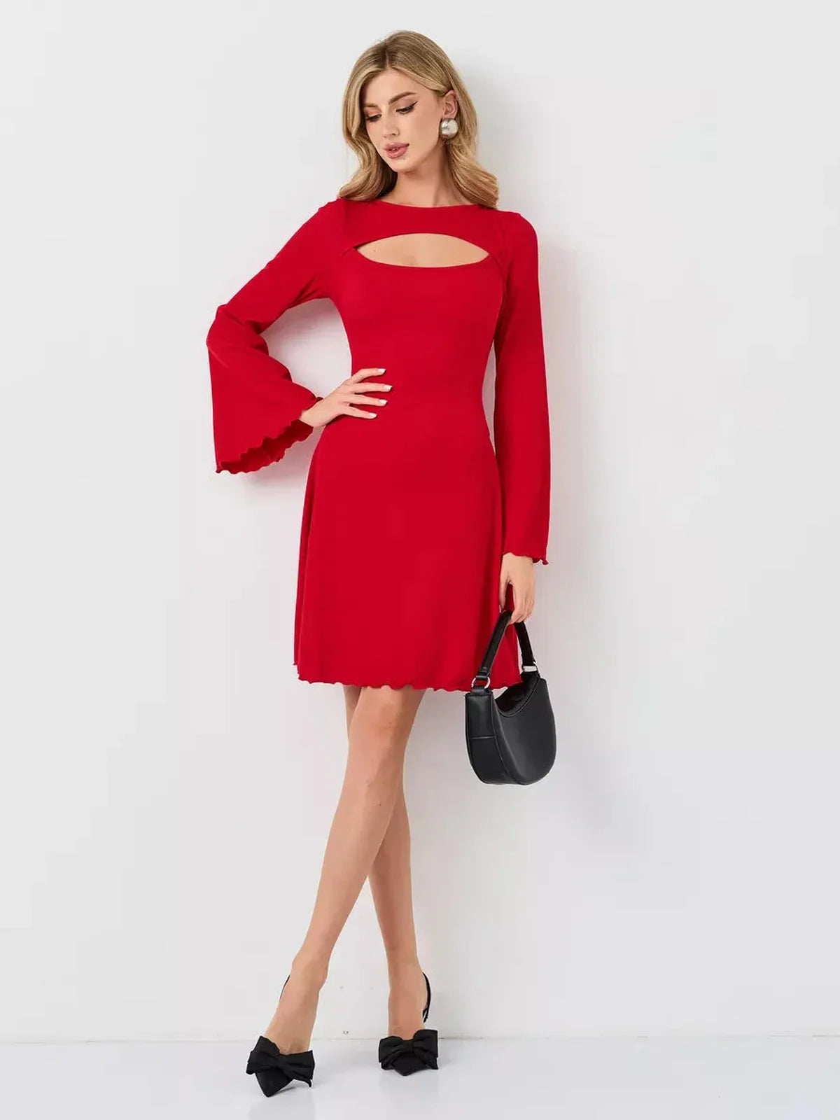 Stylish woman in a red flare cutout mini dress with bell sleeves, perfect for modern occasions.