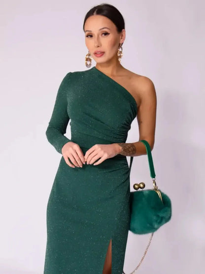 Model wearing the Emerald Spark Maxi Dress, showcasing its one-shoulder design and draped silhouette with a side slit.