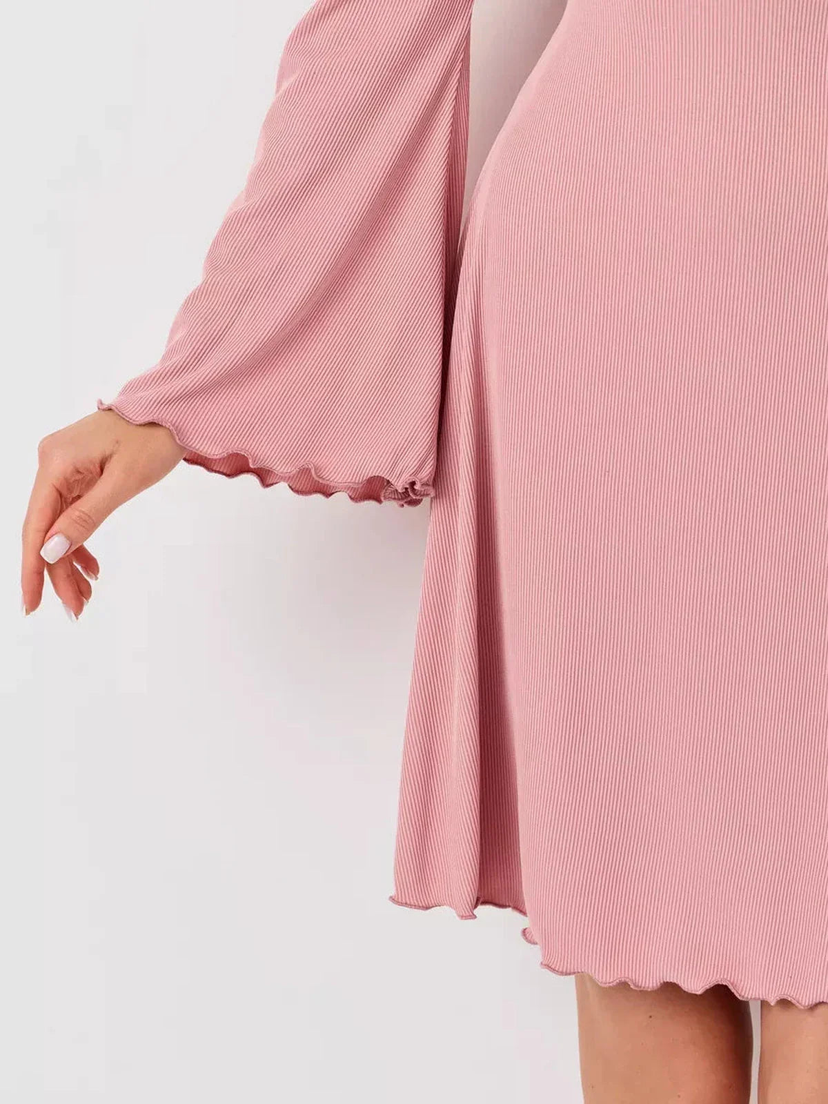 Close-up of the Blush Whisper dress showcasing its flared sleeves and soft ribbed texture, perfect for summer elegance.