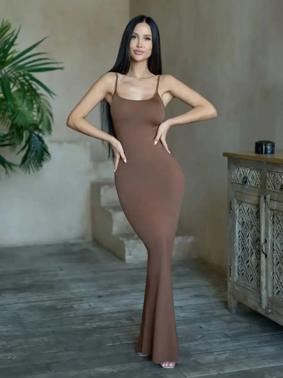 Cocoa Curve Maxi Dress in warm chocolate hue, showcasing a fitted silhouette and minimalist design, perfect for summer evenings.