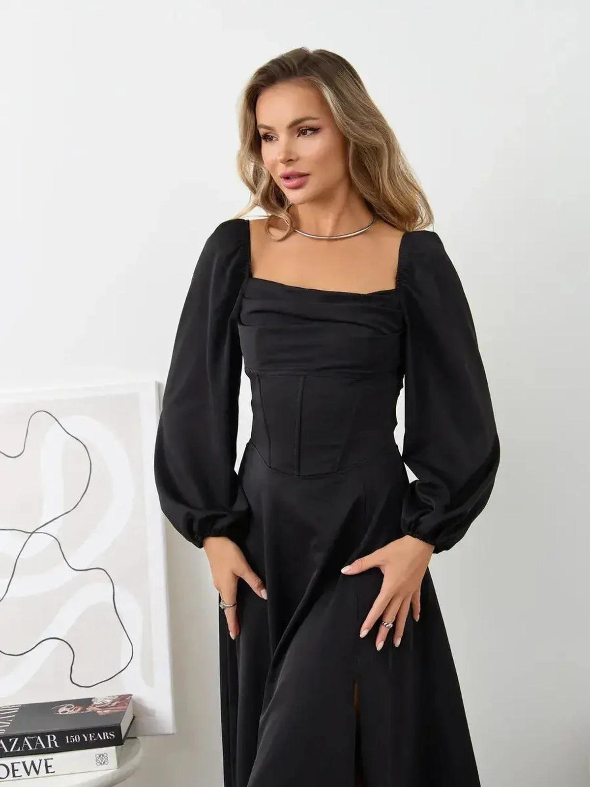Elegant Velvet Aura corset dress with square neckline and voluminous bishop sleeves in black, perfect for chic occasions.