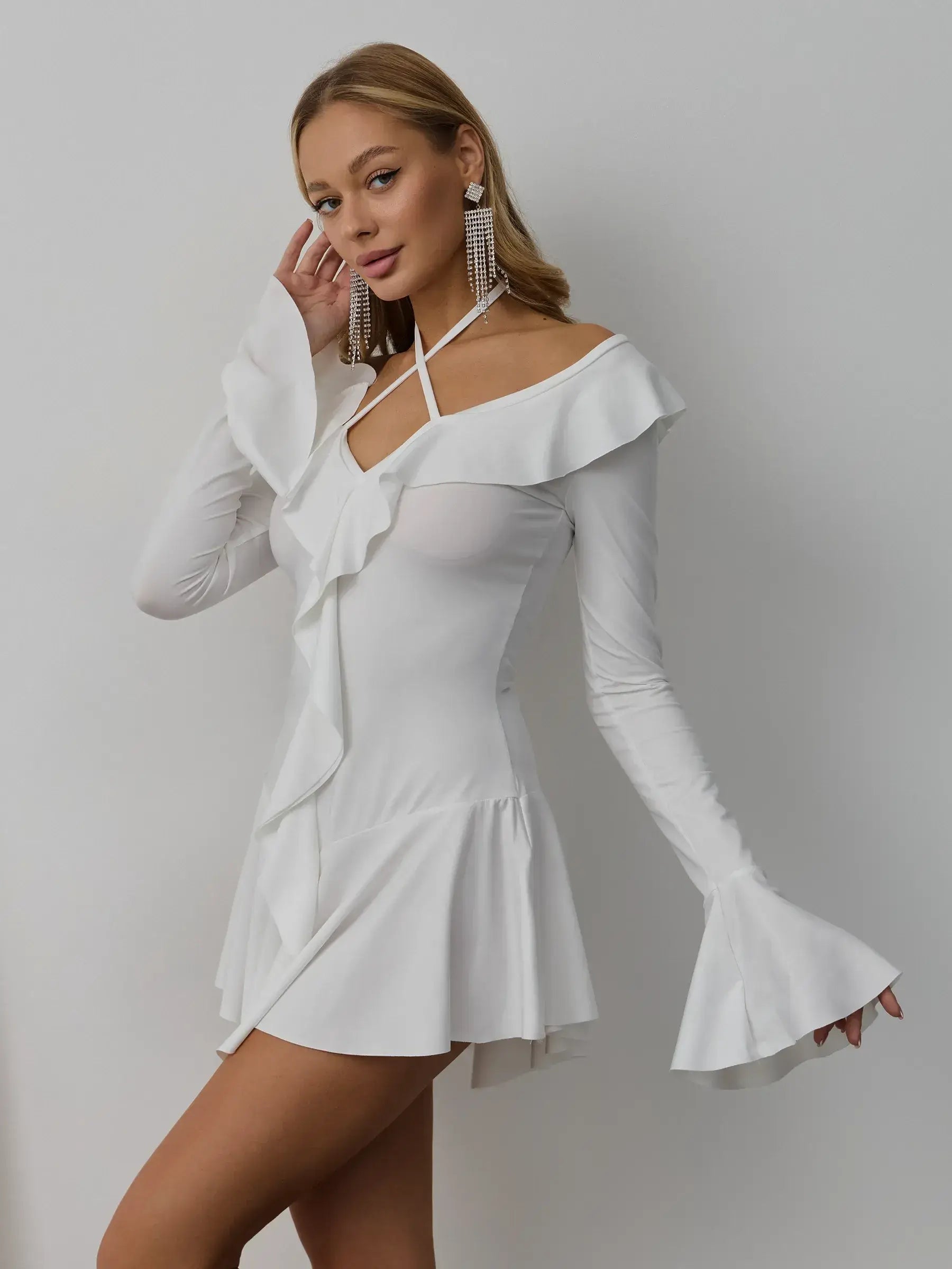 Elegant white Velina Ruffle Dress with flared sleeves, ideal for weddings and formal occasions.