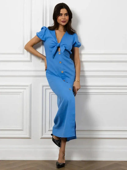 Maxi Dress Azure Charm in sky blue with V-neckline, tie detail, and button accents, perfect for timeless elegance.