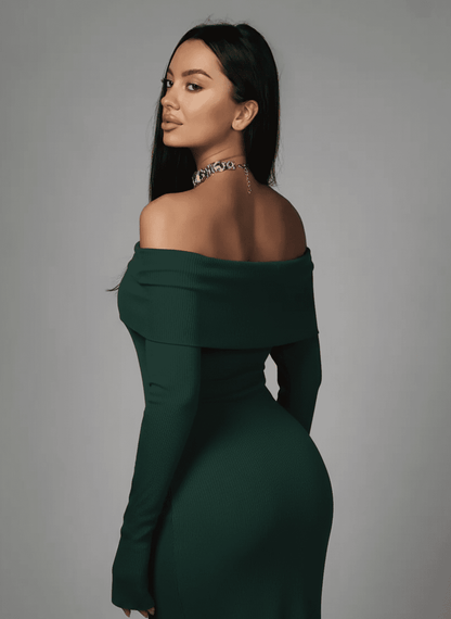 Model showcasing the Verdalia Maxi Dress by Lauven, featuring an off-shoulder design in rich emerald green.