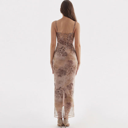 Back view of Elodie Maxi Dress showcasing its floral pattern and flattering silhouette, perfect for summer or special occasions.