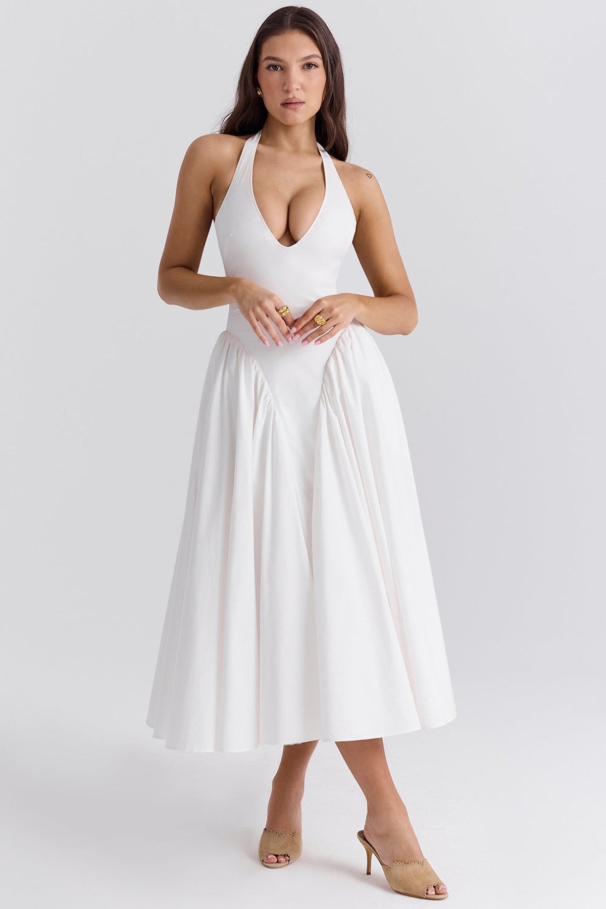 Celeste Maxi Dress in elegant white, featuring a halter neckline and flowy skirt, perfect for weddings or summer occasions.
