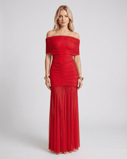 Lauven Noirline Maxi Dress featuring off-shoulder neckline, ruched bodice, and flowing sheer skirt for elegant movement.