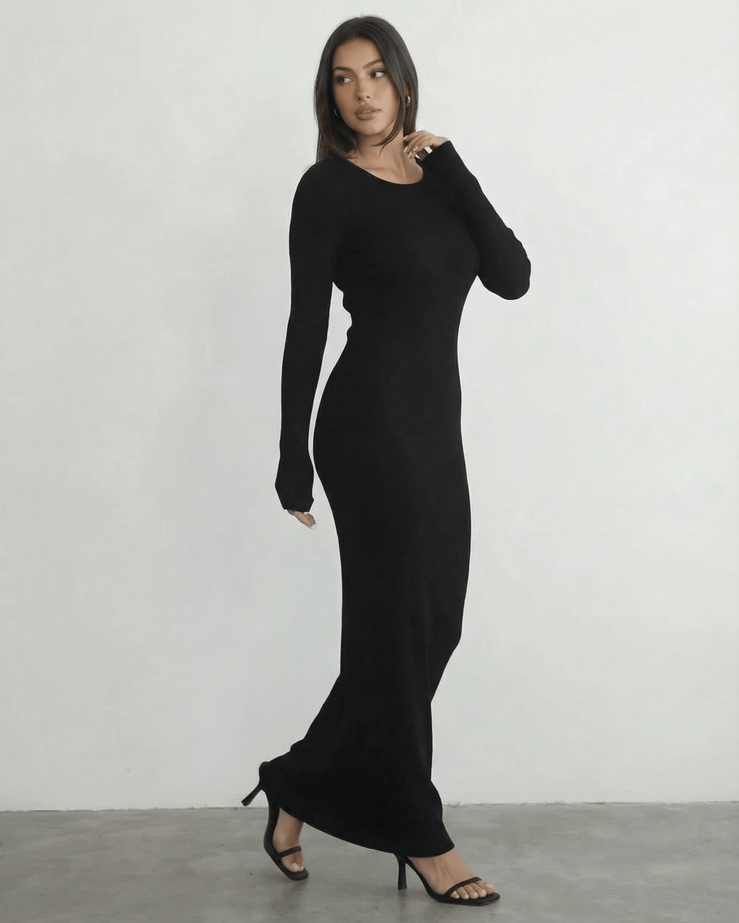 Nyx Maxi Dress by Lauven - Long sleeve black maxi dress with open back detail, showcasing its sleek silhouette.
