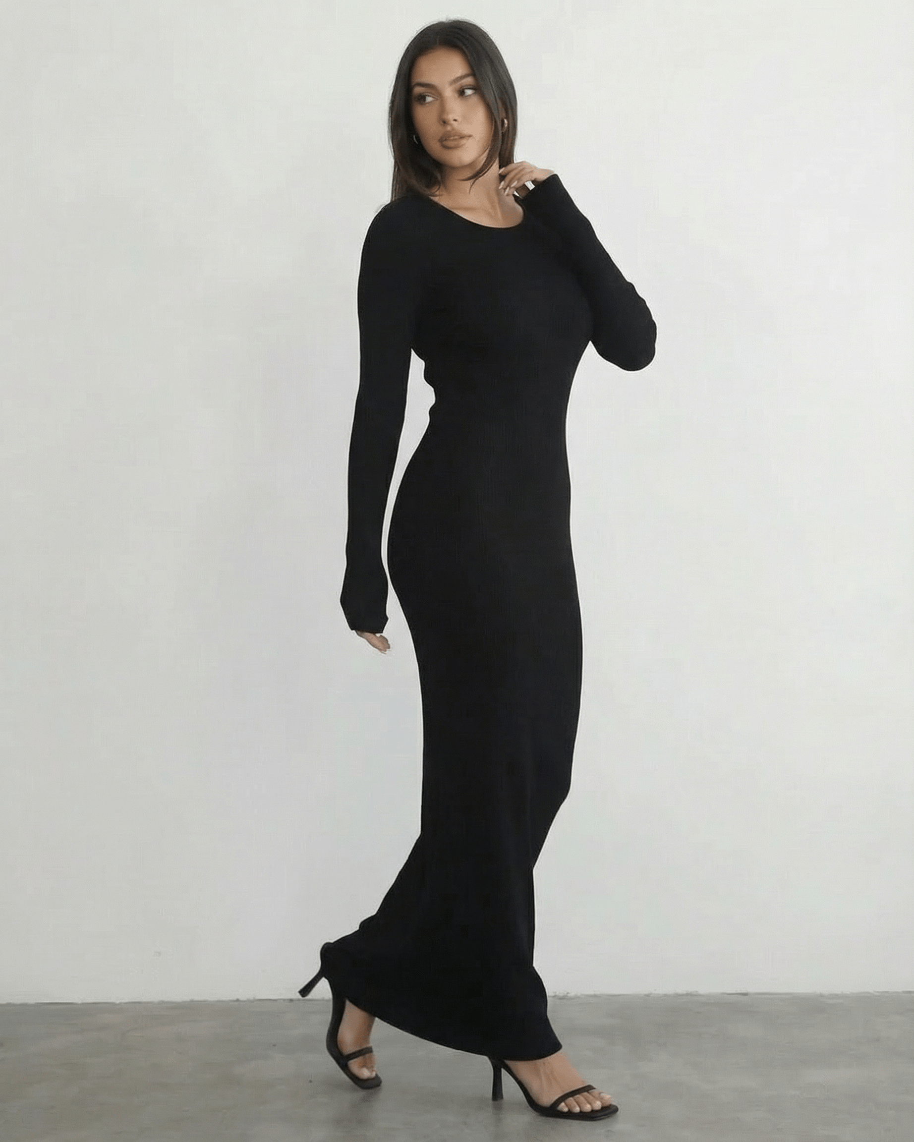 Nyx Maxi Dress by Lauven - Long sleeve black maxi dress with open back detail, showcasing its sleek silhouette.