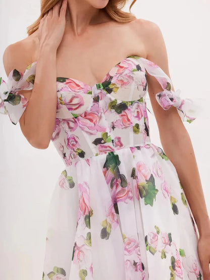 Elegant floral maxi dress with off-shoulder design and pink rose print, perfect for summer outings and special occasions.