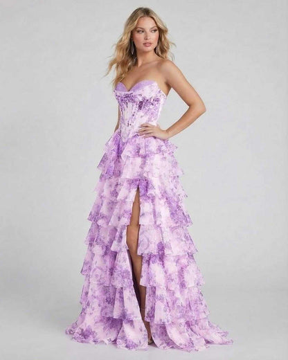 Violetta Maxi Dress by Lauven – Elegant purple floral tiered chiffon gown with high slit and corset bodice.