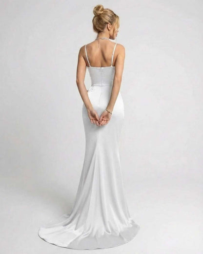 Alba Maxi Dress by Lauven, showcasing an elegant back view of the asymmetrical sleeveless design with oversized bow detail.