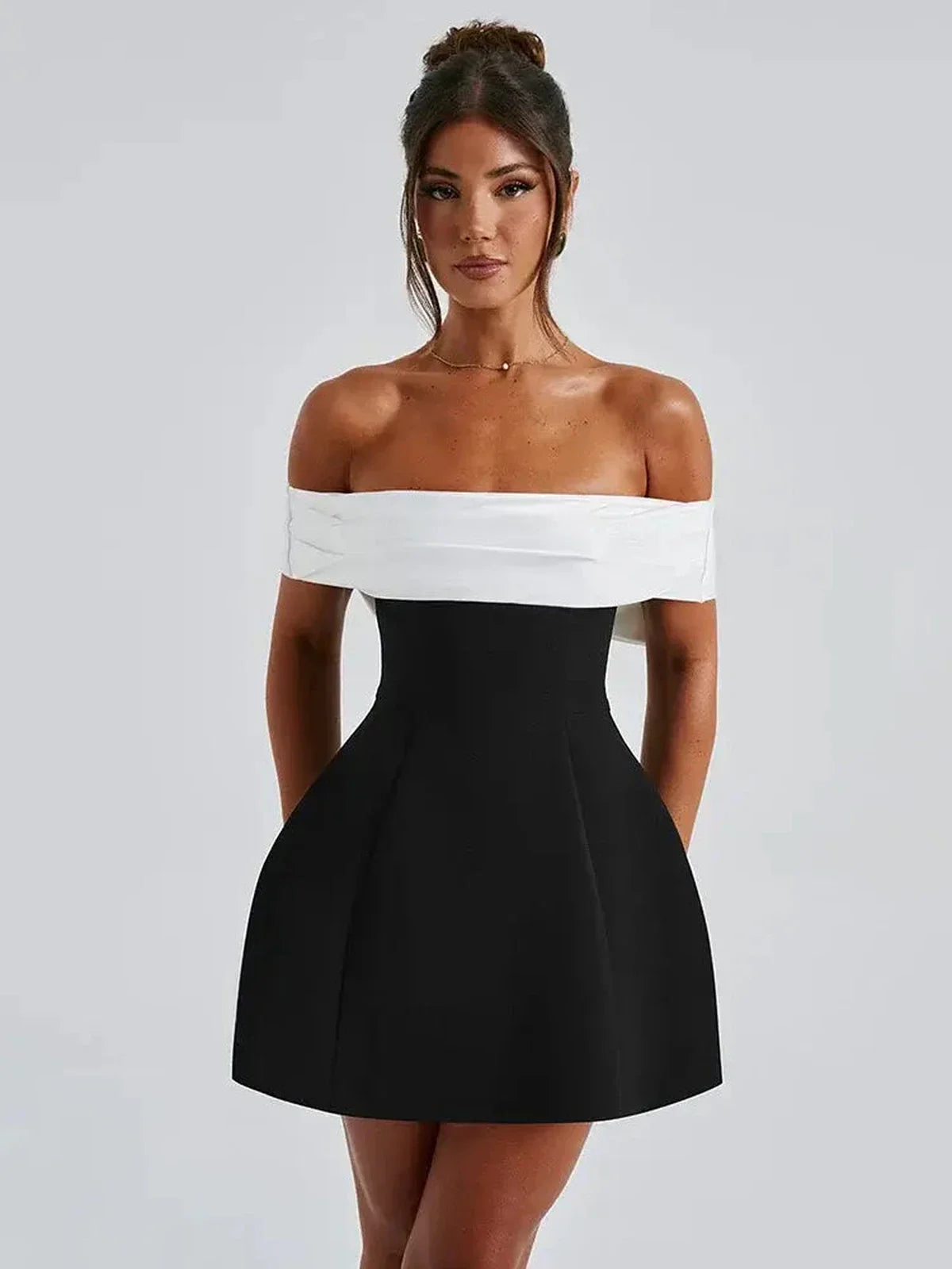 Elegant off-shoulder Alba Mini Dress featuring a structured A-line silhouette and oversized bow, perfect for summer and formal events.