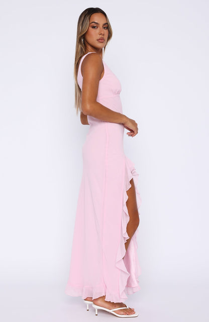 Elegant pink maxi dress with cascading ruffles and a thigh-high slit, perfect for summer, weddings, and formal occasions.