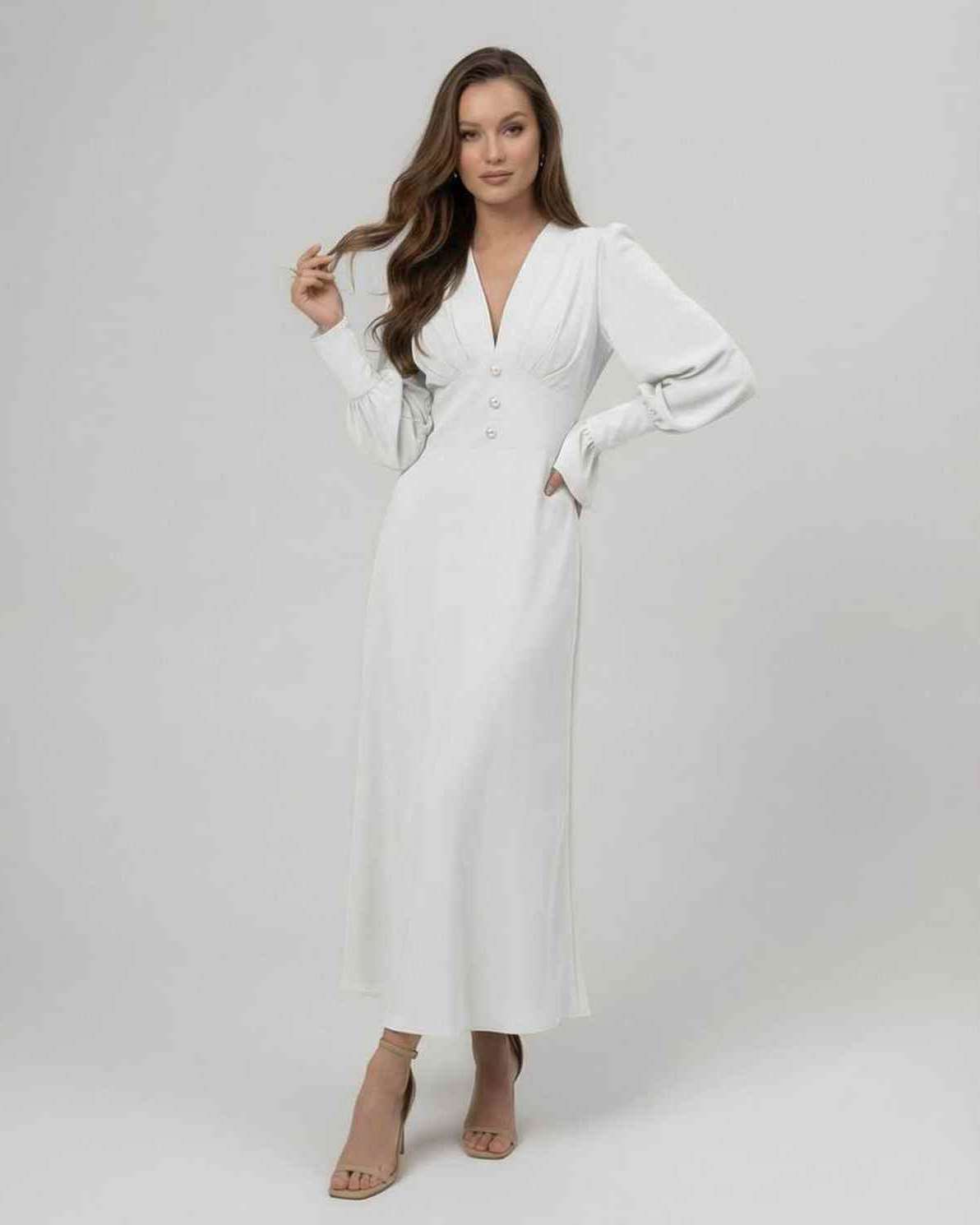 Arden Midi Dress in white with long sleeves and a V-neckline, showcasing timeless elegance from Lauven.