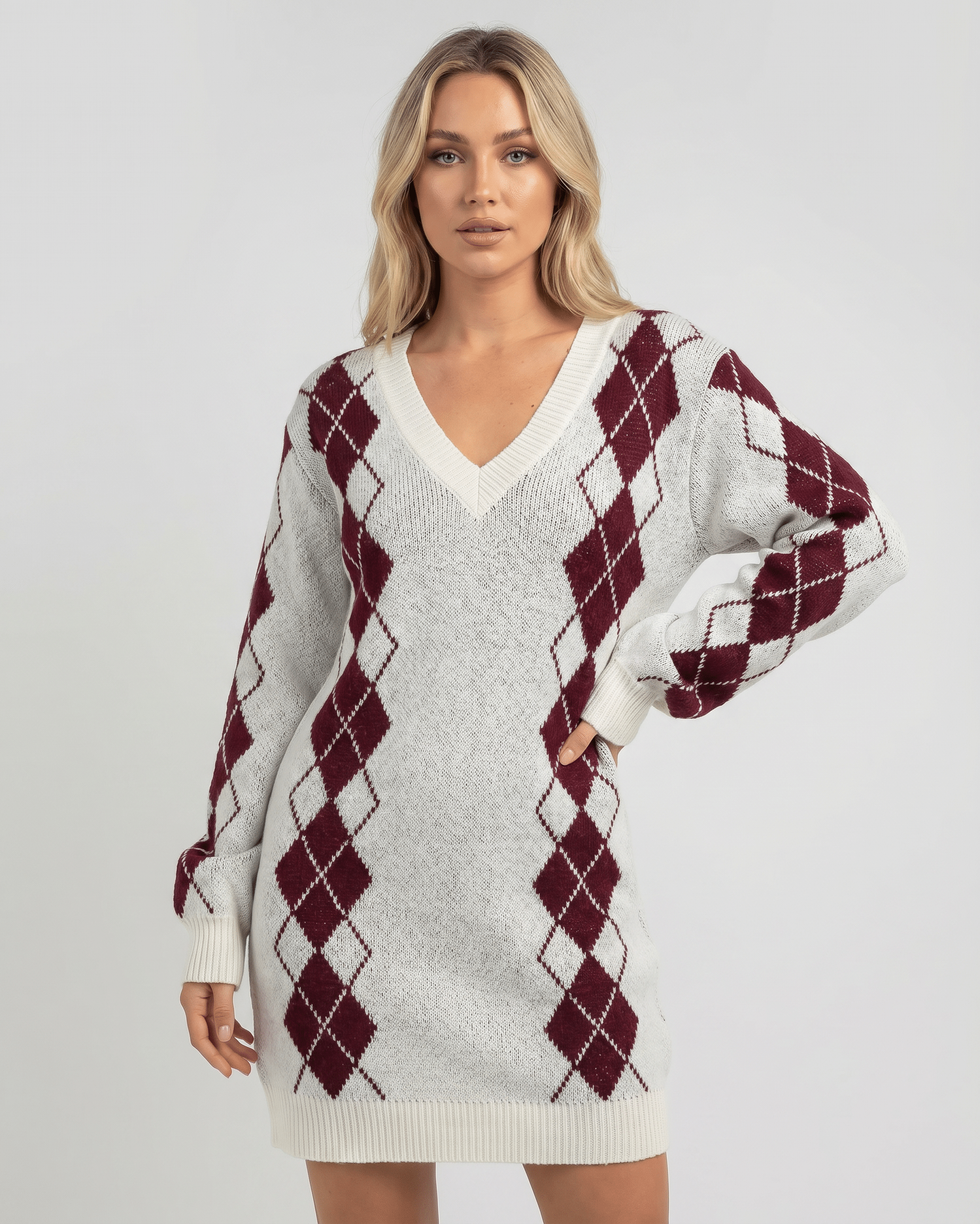 Arden Mini Dress featuring soft acrylic knit, V-neck, argyle pattern, relaxed silhouette by Lauven.