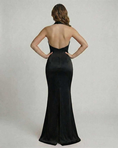 Athena Maxi Dress by Lauven, showcasing a sleek black satin design with a draped halter neck from the back.