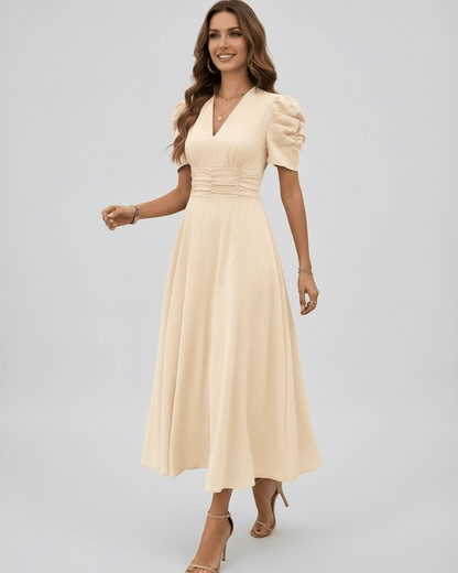 Aurelia Midi Dress is a cream midi dress with flattering puff sleeves, elegant V-neckline, perfect for weddings by Lauven.