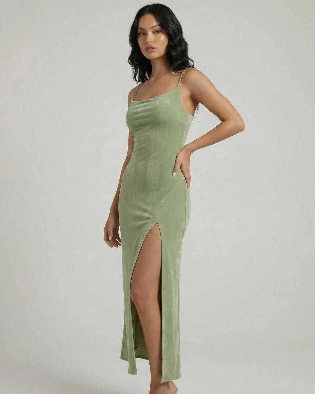 Aurelia Midi Dress by Lauven, featuring a square neck, slim fit, and asymmetrical slit in a soft green fabric.