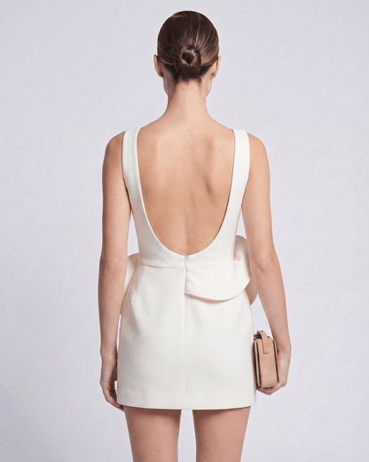 Aurelle Mini Dress featuring a boat neck, structured white design, and architectural sculptural waist detail by Lauven.