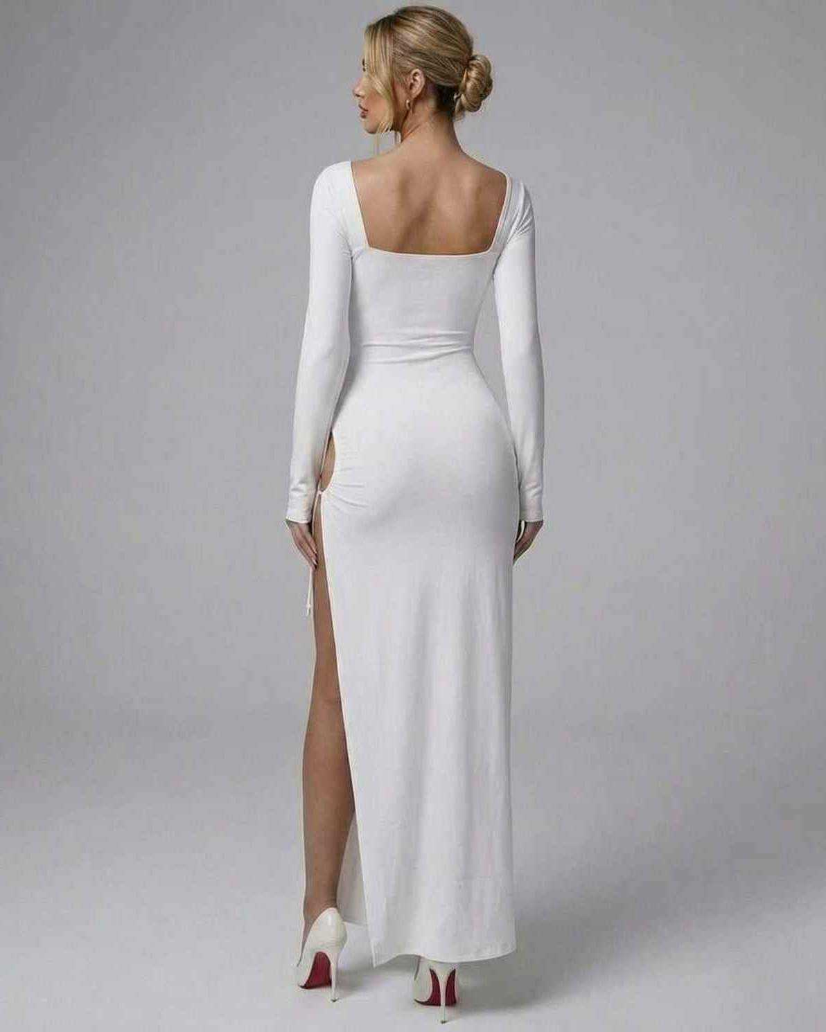 Back view of Aurielle Maxi Dress by Lauven, featuring a sleek white design and a stylish asymmetrical silhouette.