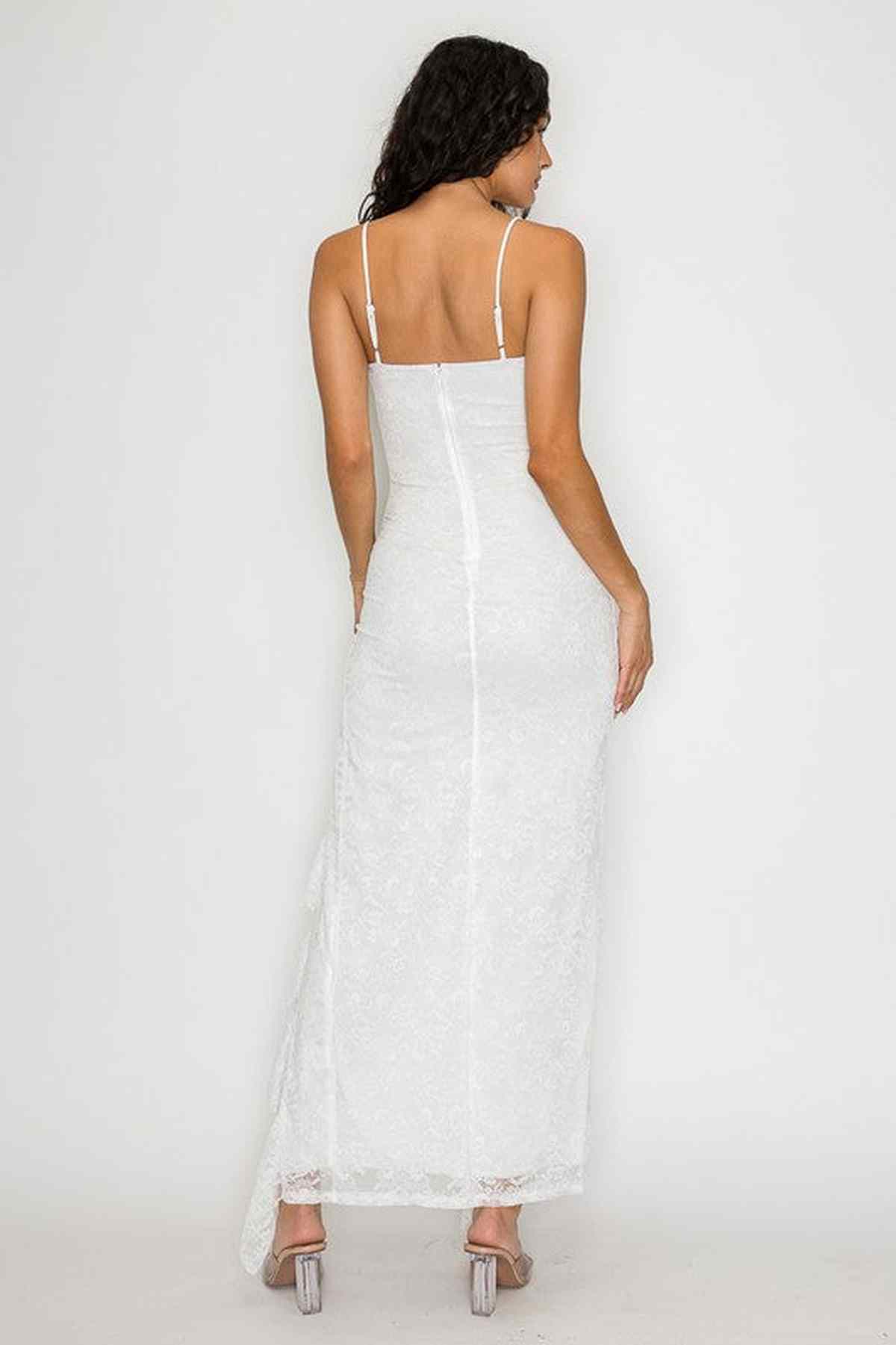 Back view of white Aurora Maxi Dress featuring delicate lace and adjustable spaghetti straps, ideal for weddings and formal events.