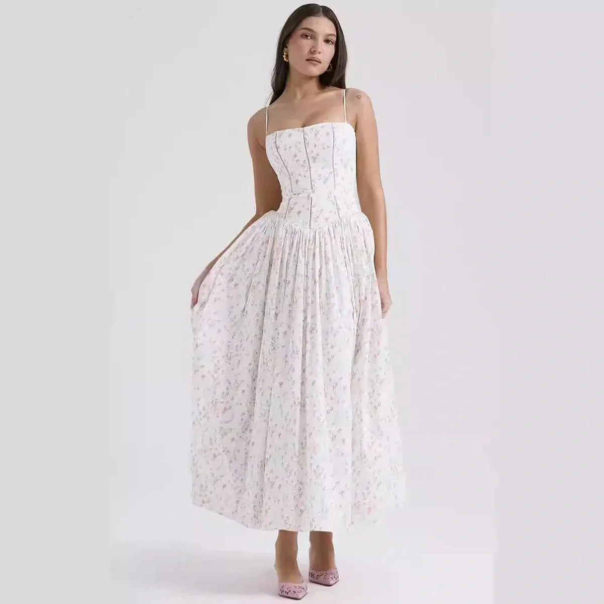 Ethereal floral maxi dress with spaghetti straps, perfect for summer weddings or formal occasions.