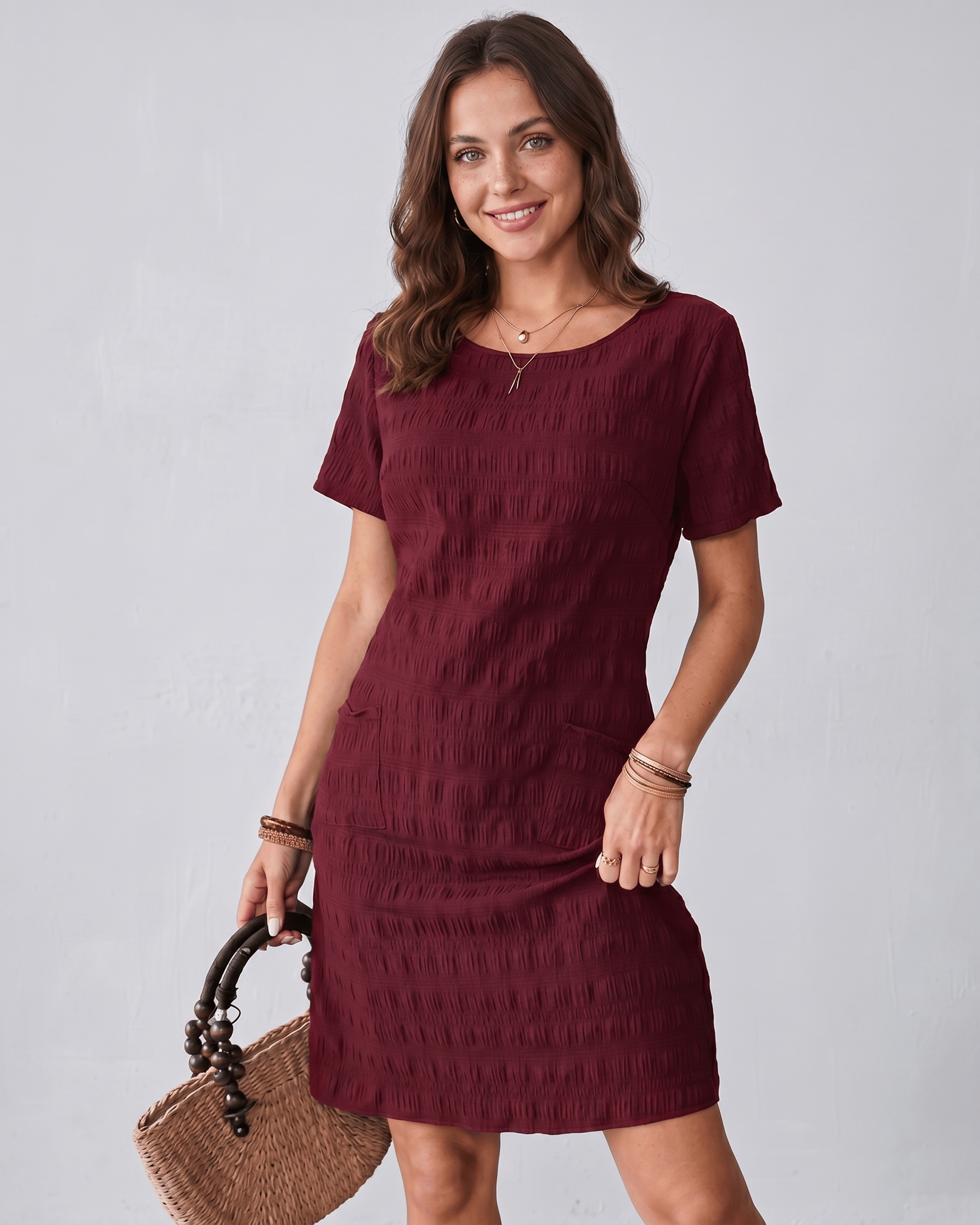 Avelin Mini Dress in textured fabric with round neckline by Lauven, offering a modern, versatile style for warm weather.