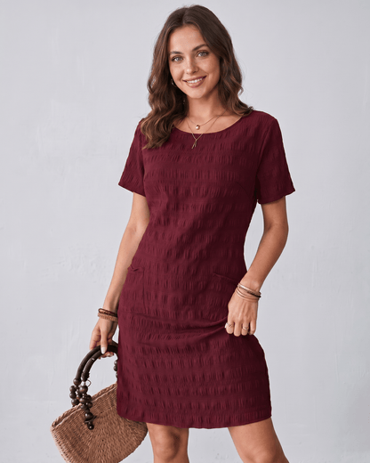Avelin Mini Dress in textured fabric with round neckline by Lauven, offering a modern, versatile style for warm weather.