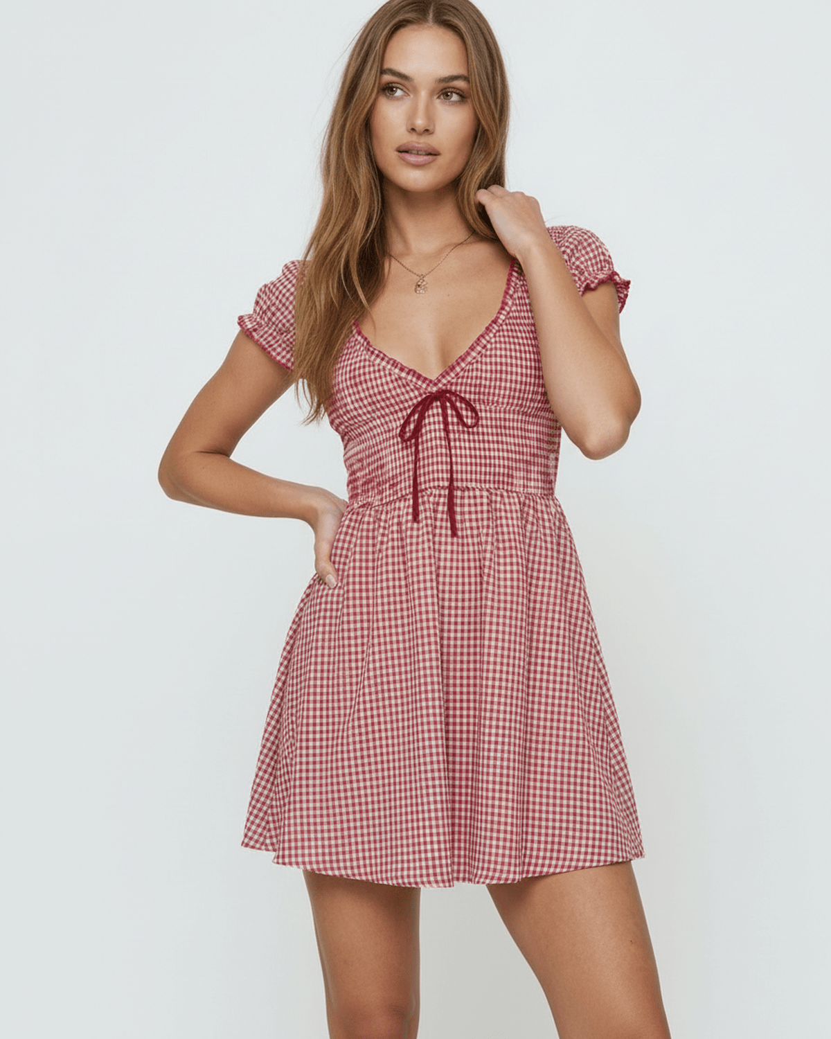 Azura Mini Dress by Lauven featuring a red checkered pattern and flattering empire waistline, perfect for autumn wear.