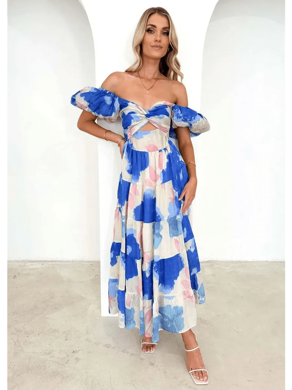 Azure Bloom Maxi Dress featuring off-shoulder design and watercolor floral prints in blue and pink.