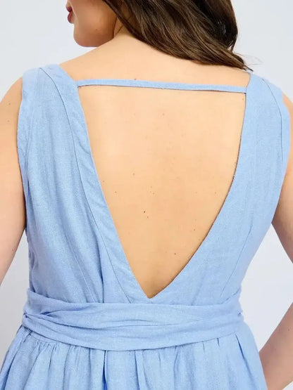 Back view of Azure Breeze Maxi Dress showcasing its elegant V-neckline and open back design.