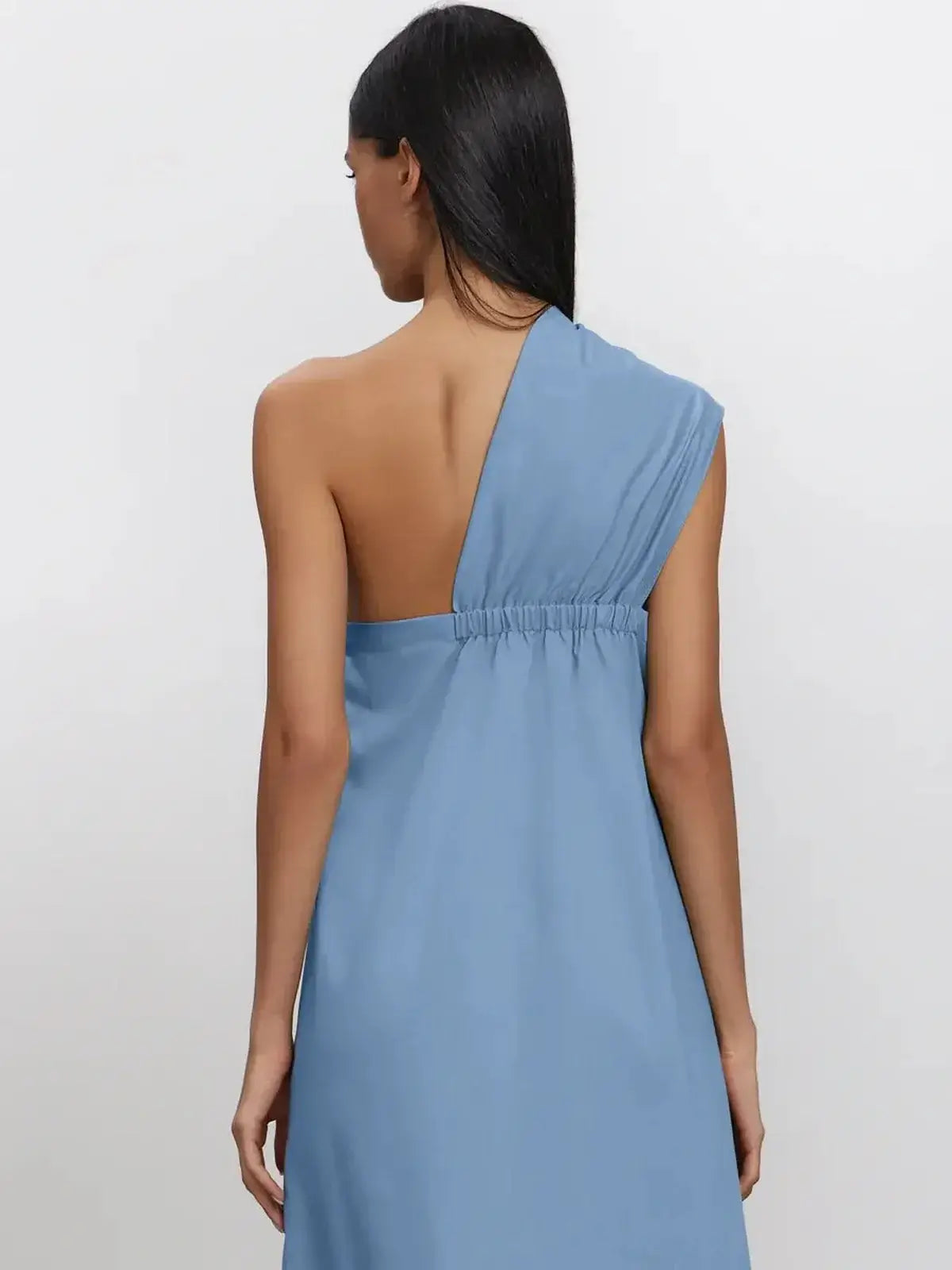Back view of Azure Drape Maxi Dress featuring an asymmetric one-shoulder design and fluid A-line silhouette.