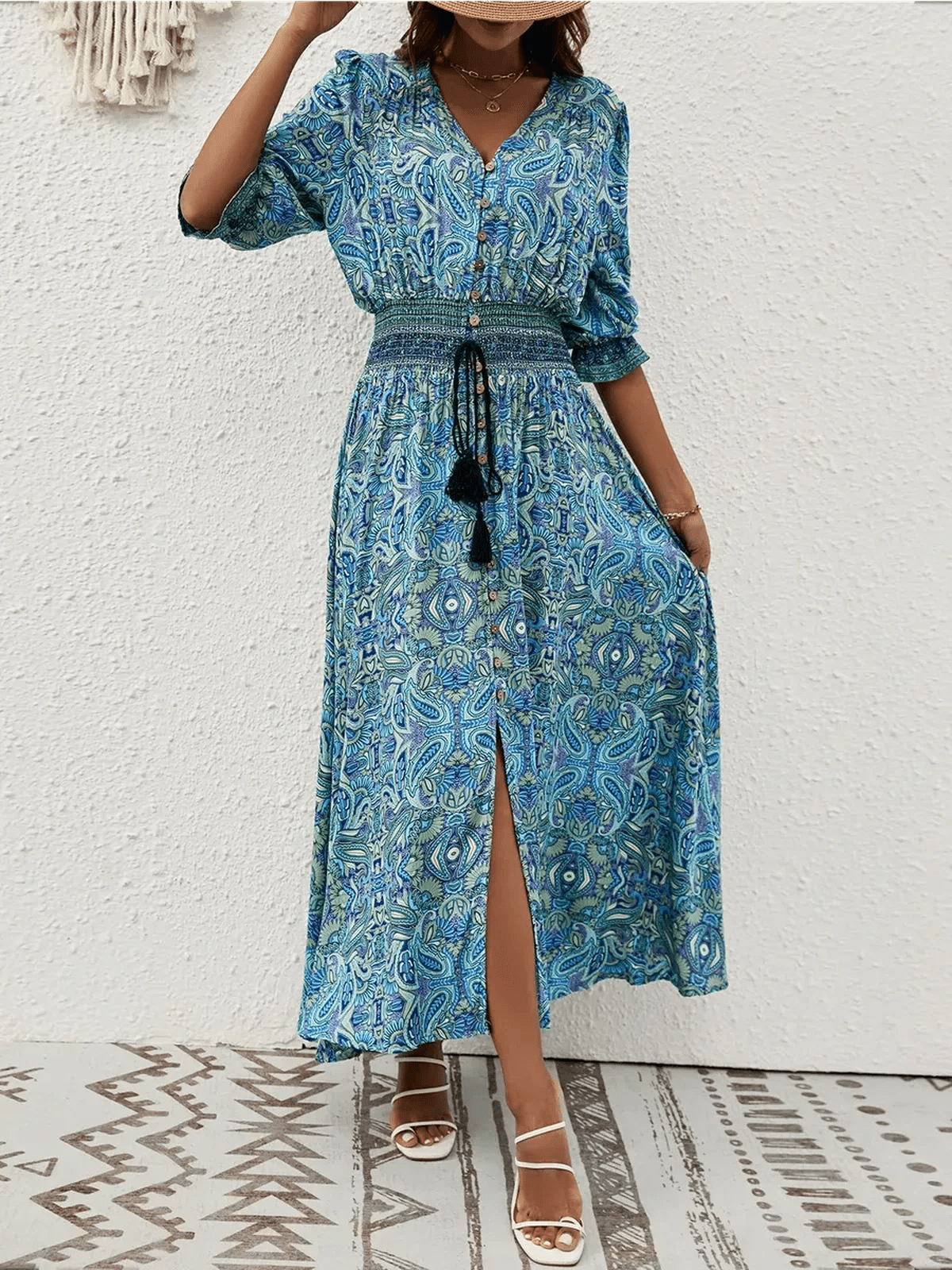 Azure Drift Maxi Dress featuring paisley print and smocked waistline, perfect for boho-chic summer styling.