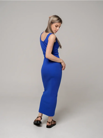 Model showcasing the Azure Elegance Maxi Dress in cobalt blue, featuring a sleek ribbed silhouette and ankle-length design.