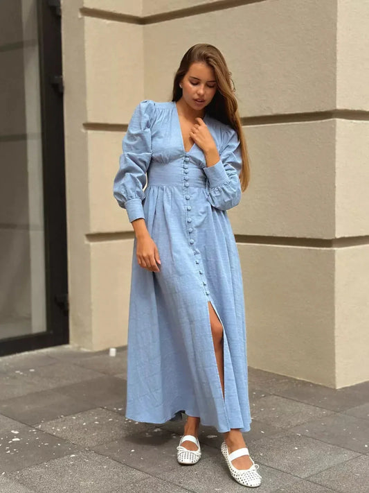 Model wearing Azure Grace Maxi Dress in light blue, featuring button detail and flowy silhouette.