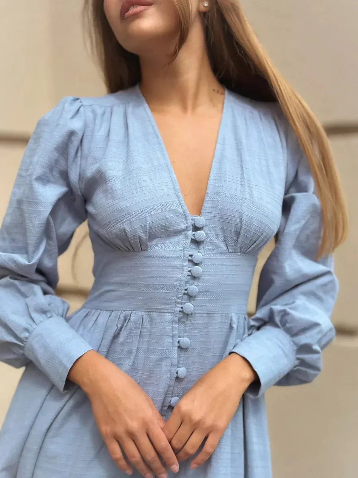 Azure Grace Maxi Dress in light blue, featuring button detail and elegant flowy silhouette.