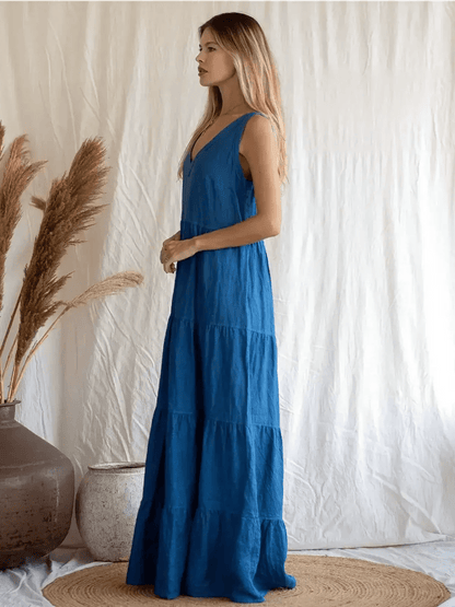 Azure Grace Maxi Dress in vibrant blue, showcasing sleeveless design and tiered skirt, perfect for elegant summer outings.