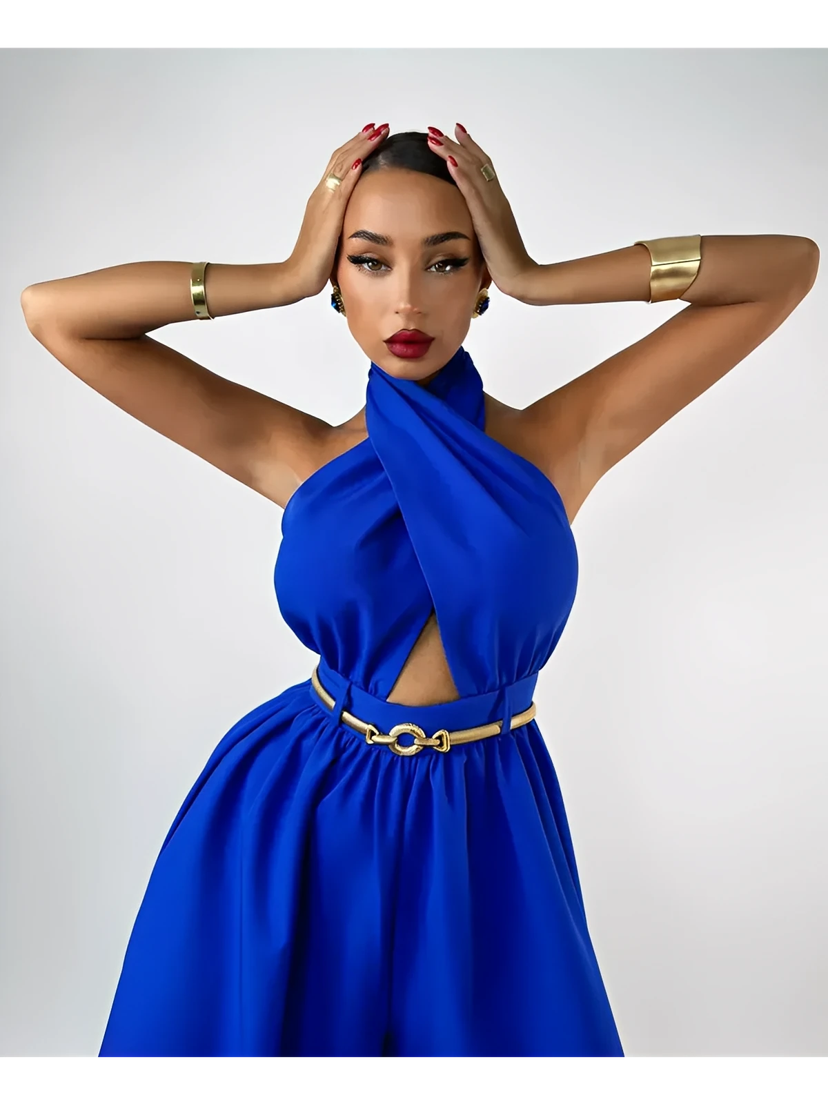 Azure halter jumpsuit with open back and wide leg silhouette, perfect for elegant summer events.
