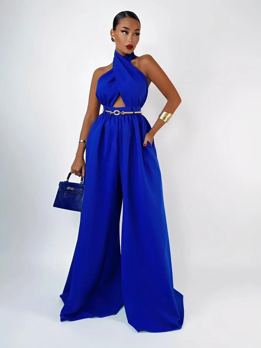 Model showcasing a stunning azure halter jumpsuit with a wide leg silhouette and open back, perfect for summer events.