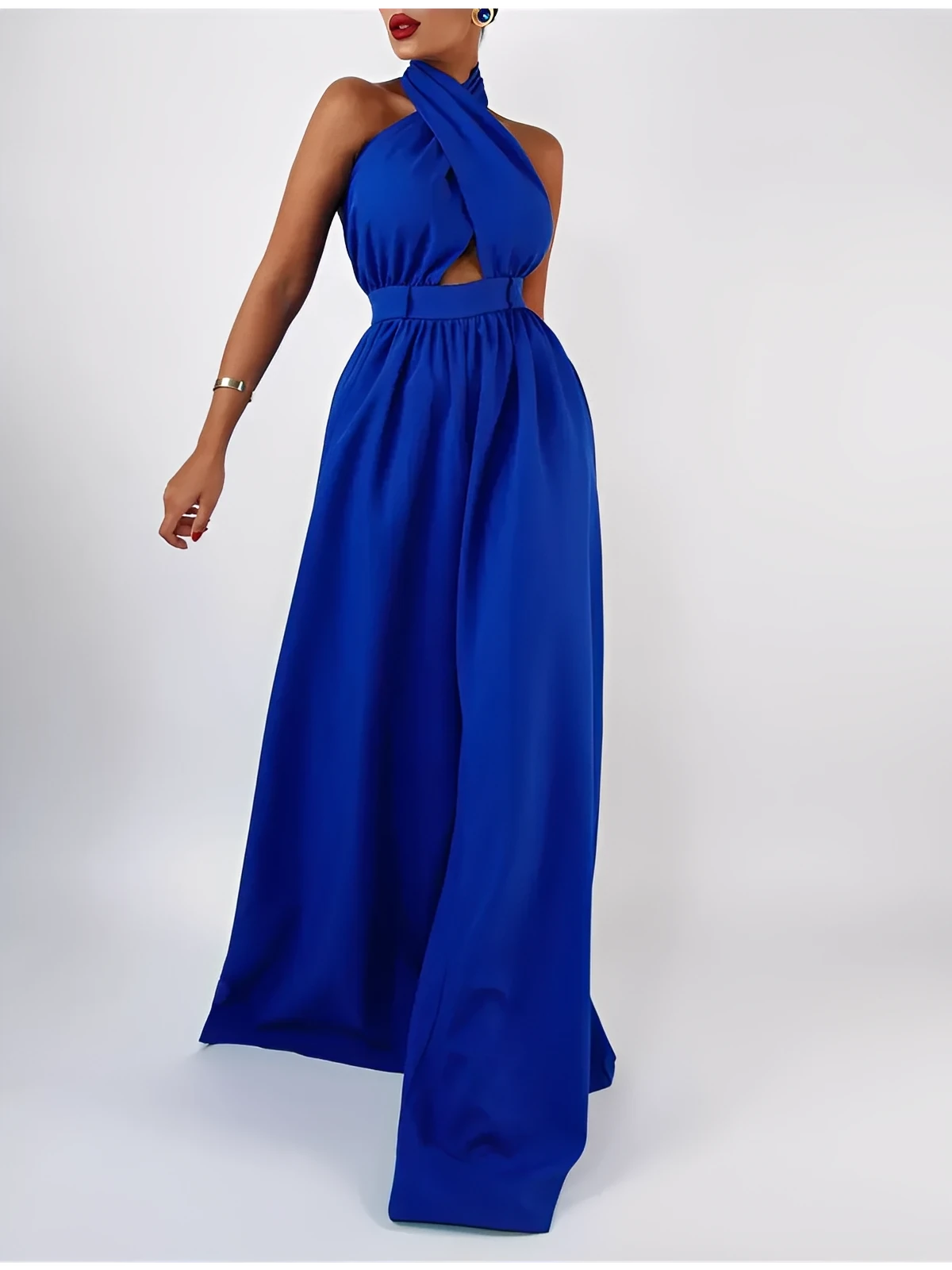 Azure halter jumpsuit featuring a bold open back and wide-leg silhouette, perfect for summer events.