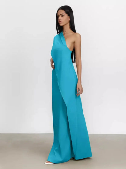Model in a vibrant turquoise one-shoulder Azure Sway Maxi Dress showcasing its airy A-line silhouette.