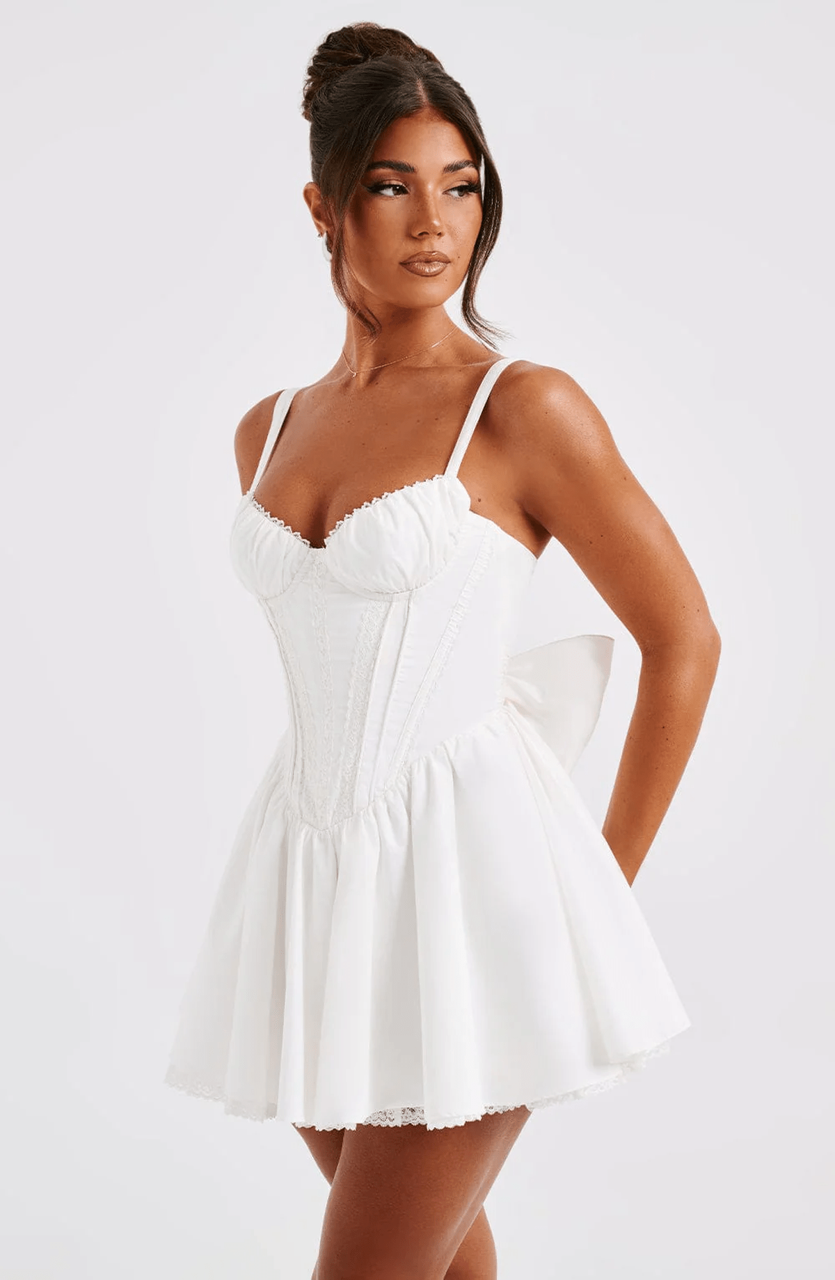 White Barbie Mini Dress with corset design and voluminous skirt, perfect for weddings and summer parties.