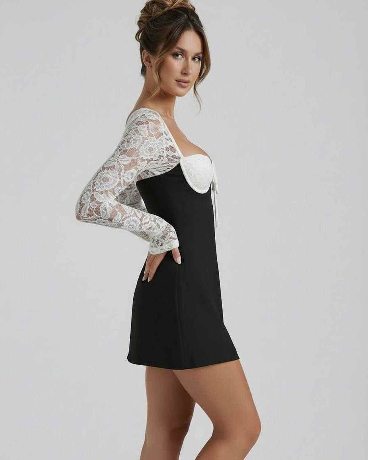 Bianca Lace Dress by Lauven, black mini dress featuring white lace sleeves and elegant detailing.