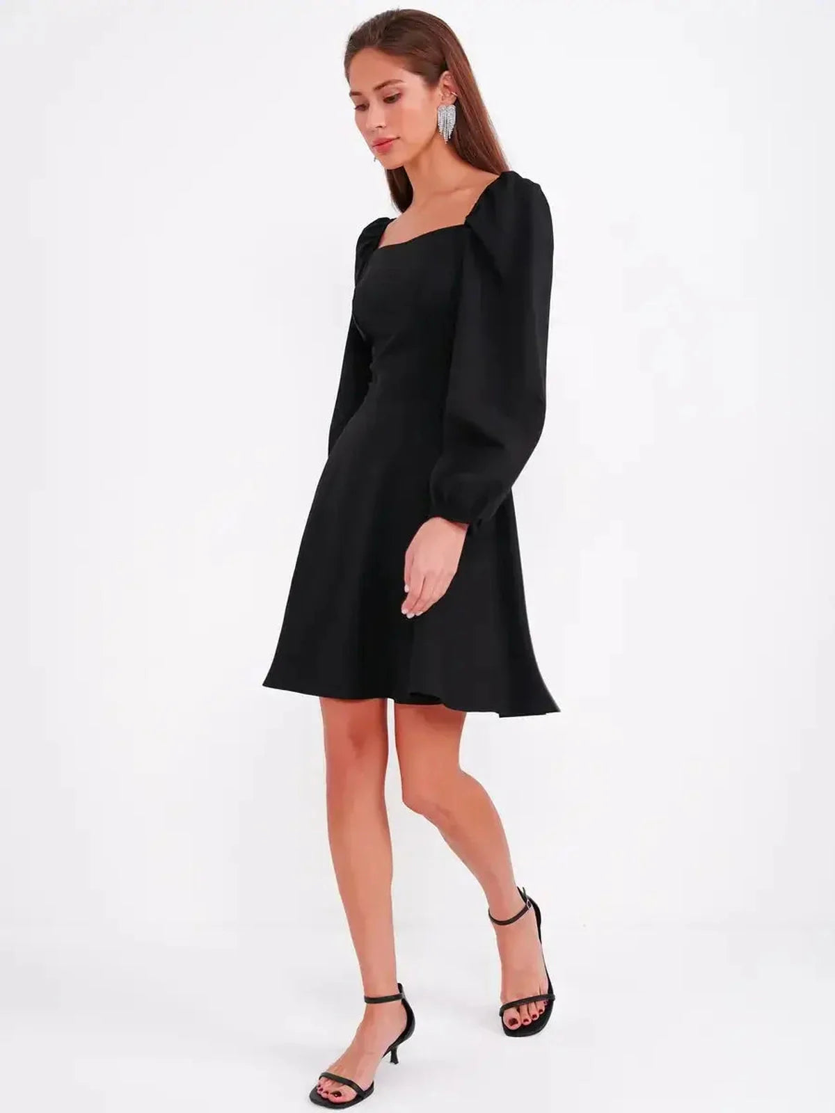 Black mini dress with a sculpted bodice, puff sleeves, and A-line skirt, perfect for weddings and parties.