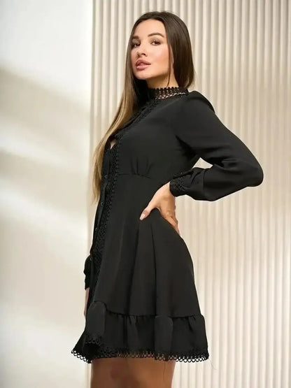 Elegant black mini dress with lace trim and flared hem, perfect for formal and cocktail events.