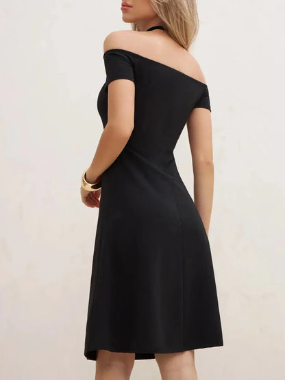 Back view of a black off-shoulder mini dress showcasing its elegant A-line silhouette and chic design.