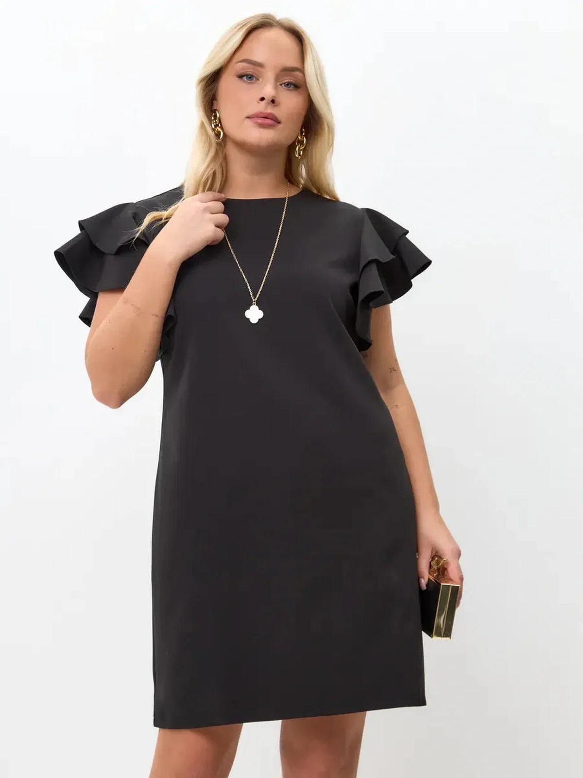 Model wearing a black mini dress with layered ruffle sleeves, showcasing elegant style and comfort for any occasion.