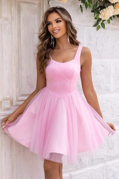 Charming pink Blair Mini Dress for women, perfect for weddings, prom, and summer parties, featuring a playful flared skirt.